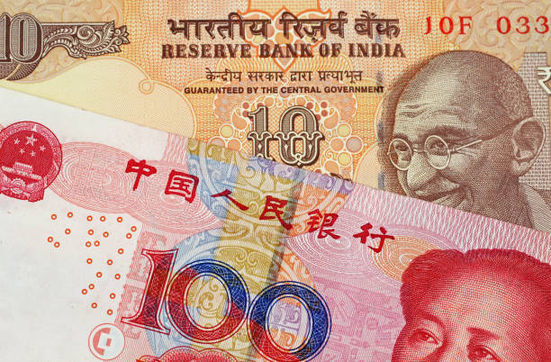 istock Chinese 100 Yuan Bank Note With 10 Indian Rupee 1021898704