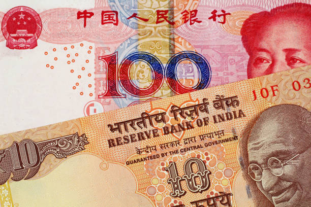 istock Chinese 100 Yuan Bank Note With 10 Indian Rupee 1021898720