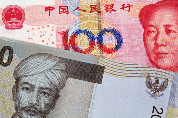 istock Chinese 100 Yuan Bank Note With 2000 Indonesian Rupiah bank note 1021898782