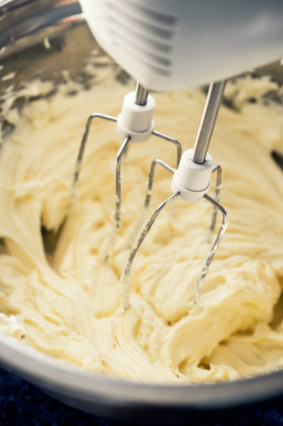 istock Whipped sweet cream with a mixer for dessert 1021903274