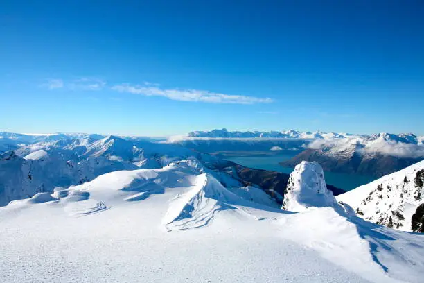 Glacier view from top of mountain in Queenstown, New Zealand. You can see the snow, lake, mountains and blue sky, full of layers, breath taking landscape of 100% Pure New Zealand. A greatest travel destination.
