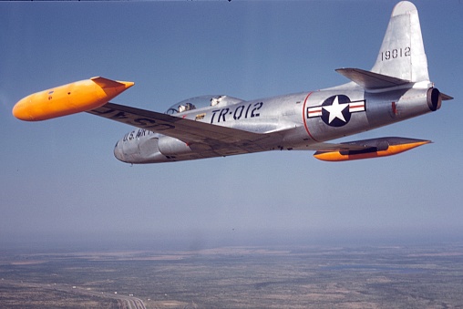 Douglas AD-5N Skyraider dive bomber with extra fuel tank and torpedo taxiing. Photo taken in 1953.