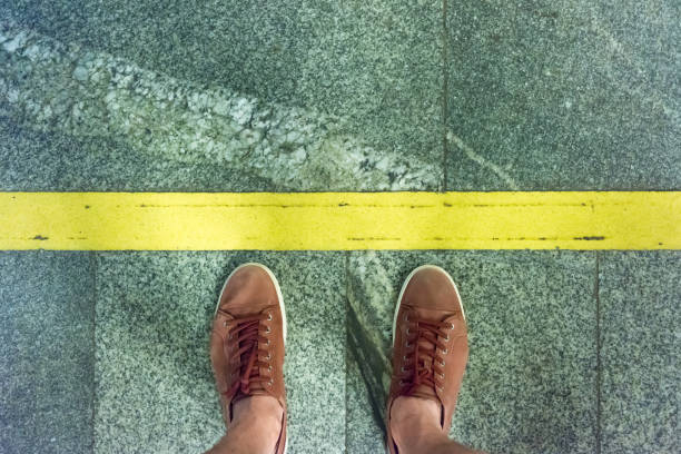 istock A young man stands on a platform at the warning yellow line in the subway 1021915528