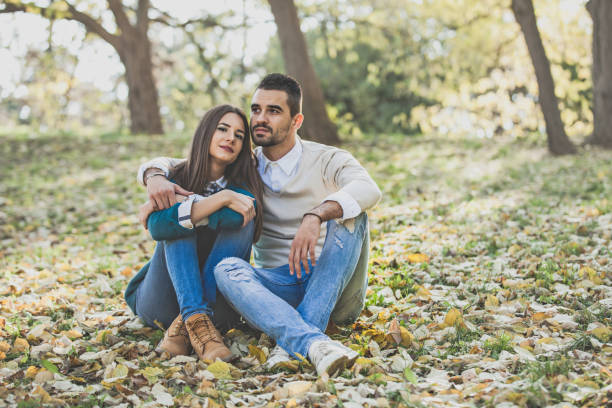 istock Beautiful Young Couple Enjoying the Fall at Park 1021924466