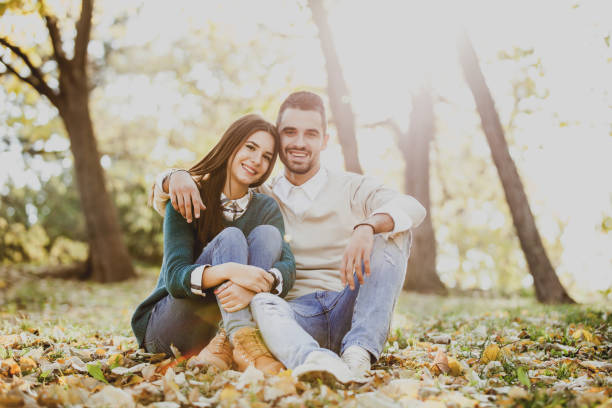 istock Beautiful Young Couple Enjoying the Fall at Park 1021924472