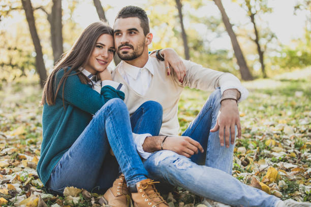 istock Beautiful Young Couple Enjoying the Fall at Park 1021924490