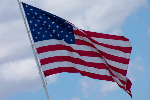 istock USA Flag waving on a beautiful summer day 1021945208