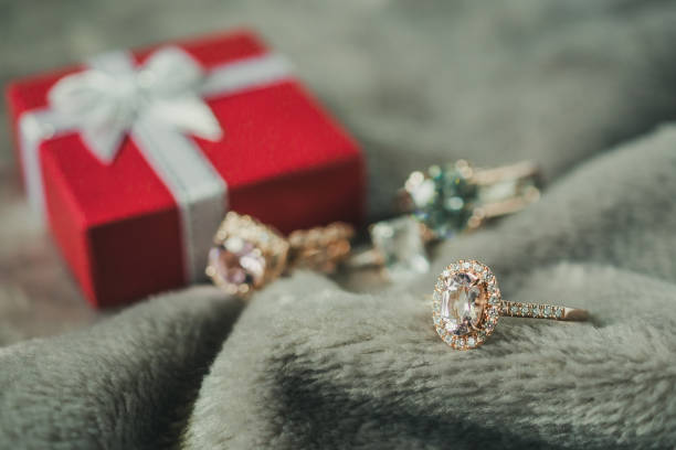 istock jewelry pink diamond ring with red gift box background 1021950186
