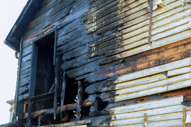 istock Fire line in front of a destroyed home. burnt house after fire 1021955272