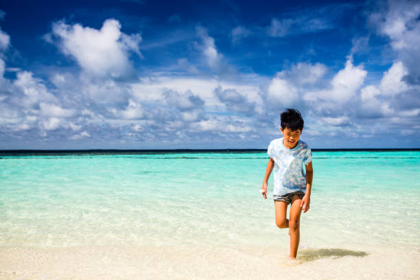 A young boy by the sea