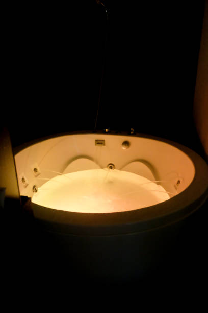 istock hot tub focus light in the darkroom 1021998474