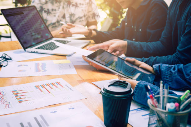 istock Asian colleagues using tablet and analysis about financial result working together. 1022015112