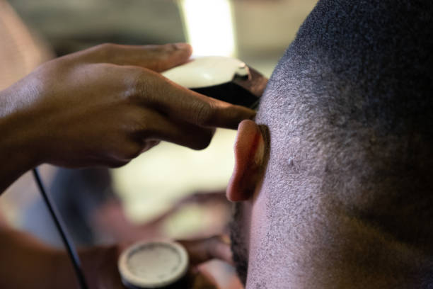 istock Visiting the local township barber 1022022226