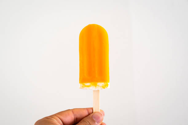 istock A orange ice cream against white wall 1022024702