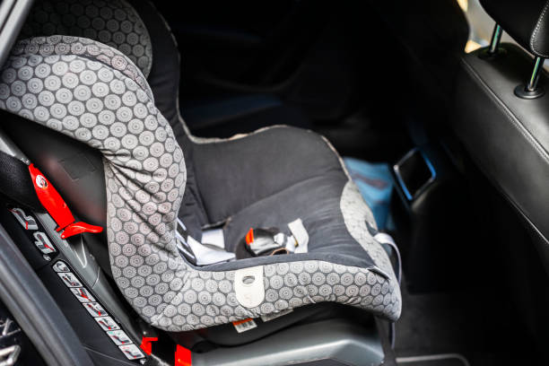 Child safety seat in the back of the car. Baby car seat for safety. Car interior. Car detailing Child safety seat in the back of the car. Baby car seat for safety. Car interior. Car detailing empty baby seat stock pictures, royalty-free photos & images