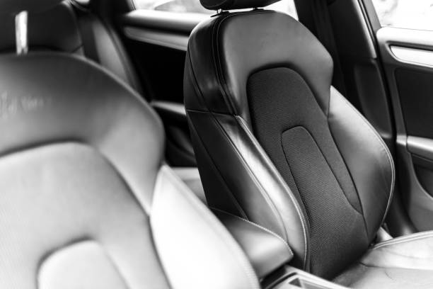 istock Car inside. Interior of a car. Comfortable leather Black seats. Black perforated leather. Car interior details. Car detailing 1022030324