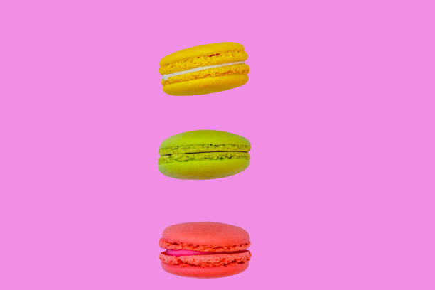 istock Tasty colorful macaroons on pink background 1022030416