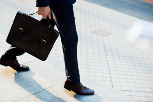istock Man carrying his bag to work 1022030554