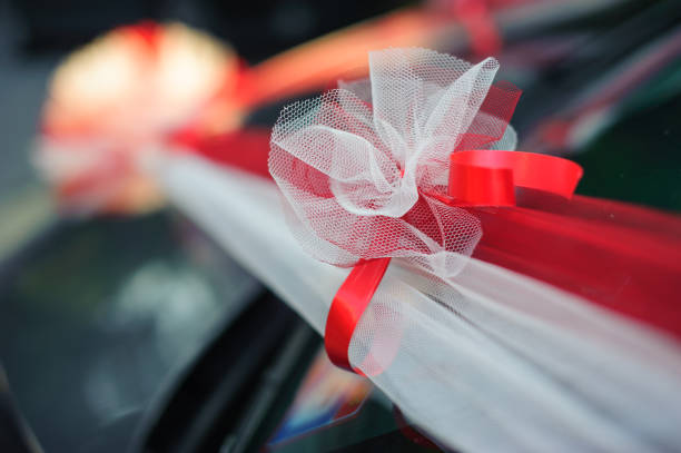 istock Color Ribbon decorations on the wedding car handle 1022038804