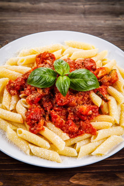istock Penne with tomato sauce and pork 1022041400