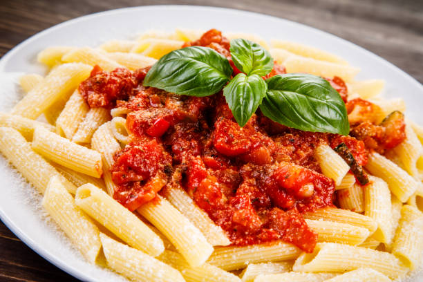 istock Penne with tomato sauce and pork 1022041450