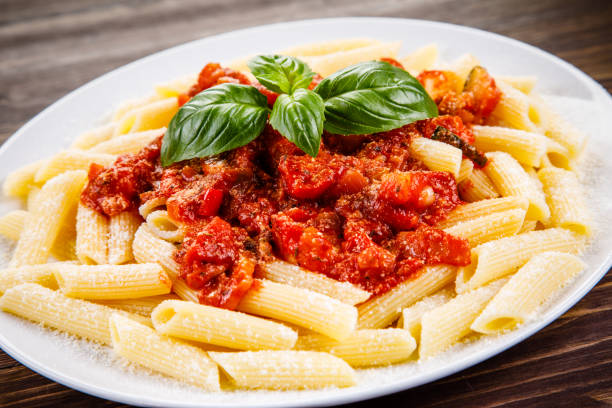 istock Penne with tomato sauce and pork 1022041510