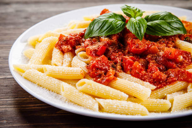 istock Penne with tomato sauce and pork 1022041948