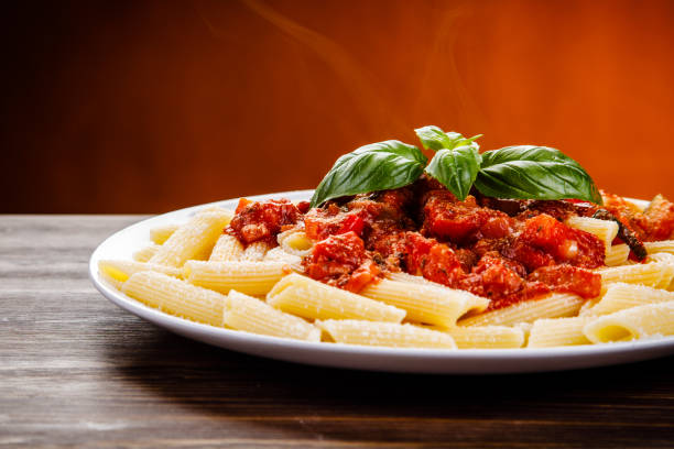 istock Penne with tomato sauce and pork 1022042102