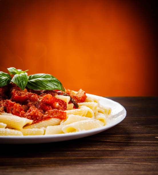 istock Penne with tomato sauce and pork 1022042236