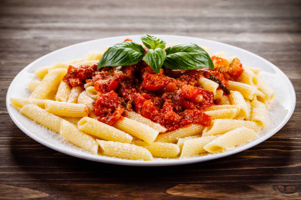 istock Penne with tomato sauce and pork 1022042280