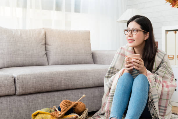 istock smile Asian woman drinking hot chocolate 1022060308