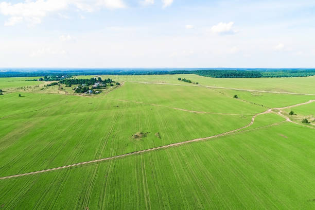 istock Flying over the village, fields and forests. Beautiful bird's-eye view. 1022060458