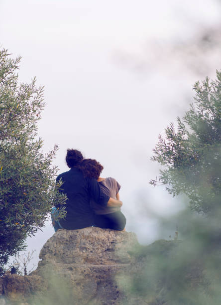 istock Rear view of hugging couple 1022061118