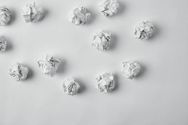 istock top view of spilled crumpled papers on white surface 1022065630