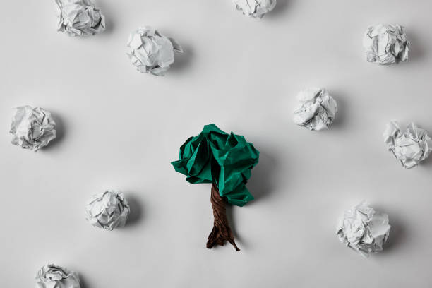 istock top view of crumpled papers in shape of tree on white surface 1022065672