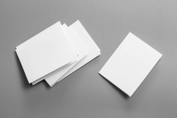 istock Blank portrait mock-up paper. brochure magazine isolated on gray, changeable background / white paper isolated on gray 1022069310