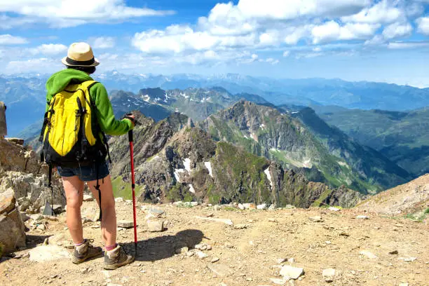 Photo of woman hiker on the trail of  Pic du Midi de Bigorre in the Pyrenees