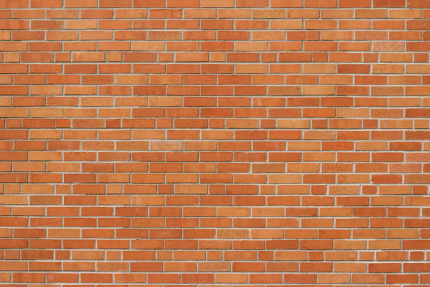 istock Reddish orange vintage brick wall background with a grunge look 1022072250