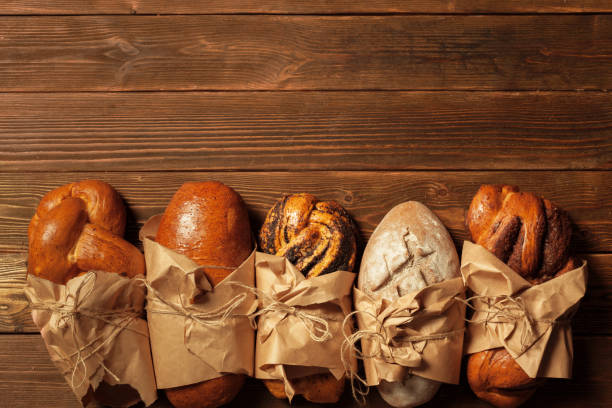 istock Freshly baked bread on wooden table 1022072344