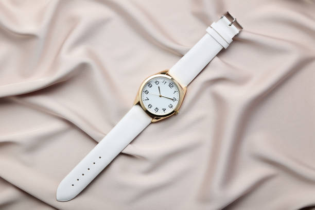 istock Wrist watch on beige satin background 1022072890