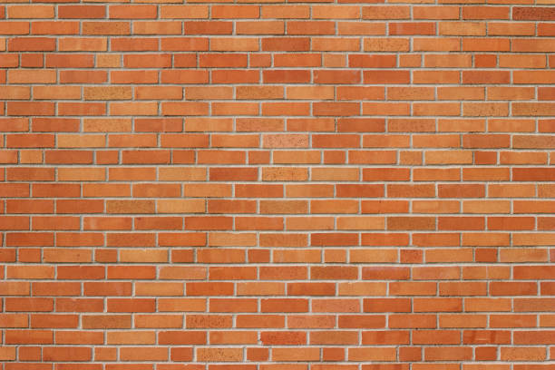 istock Reddish orange vintage brick wall background with a grunge look 1022073004