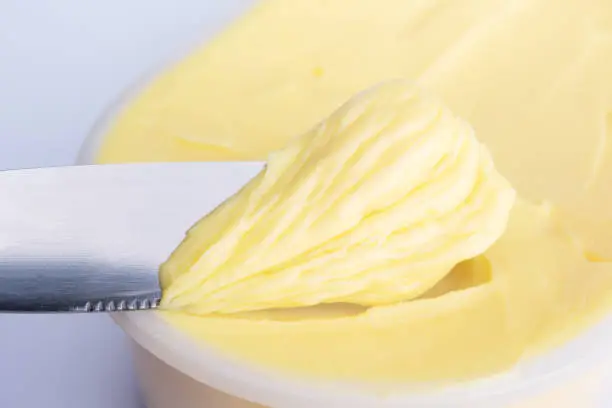 Cheese butter or margarine with knife