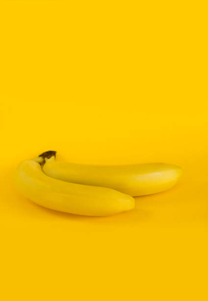 istock Sweet yellow bananas on a yellow background. 1022081514