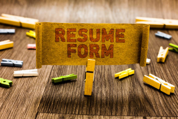 istock Word writing text Resume Form. Business concept for describe the layout elements appearing in written document Clothespin holding old piece fabric several clothespins wooden floor. 1022085178