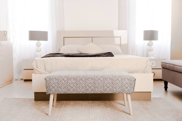 interior of modern light bedroom with soft bed and lamps