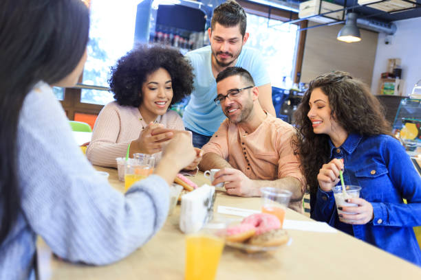 istock Young adults taking selfie in cafe 1022096800