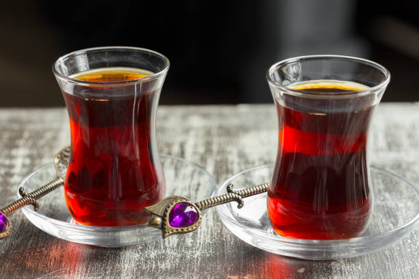 istock Red tea in turkish glasses on a wooden table 1022097008