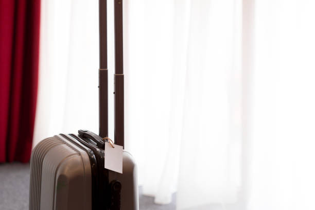 istock Suitcase or luggage bag in a modern hotel room 1022097230