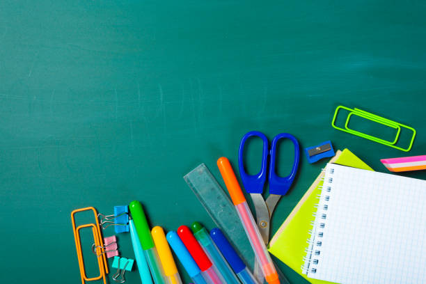 istock School and office supplies on blackboard 1022101876