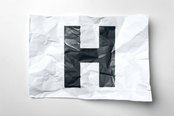 istock Grunge wrinkled paper letters on white background 1022102186